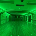 YogaLife’s wood-panelled studio with green lighting
